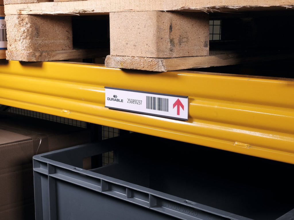Durable C-profile label holder with a barcode label on a yellow pallet racking beam