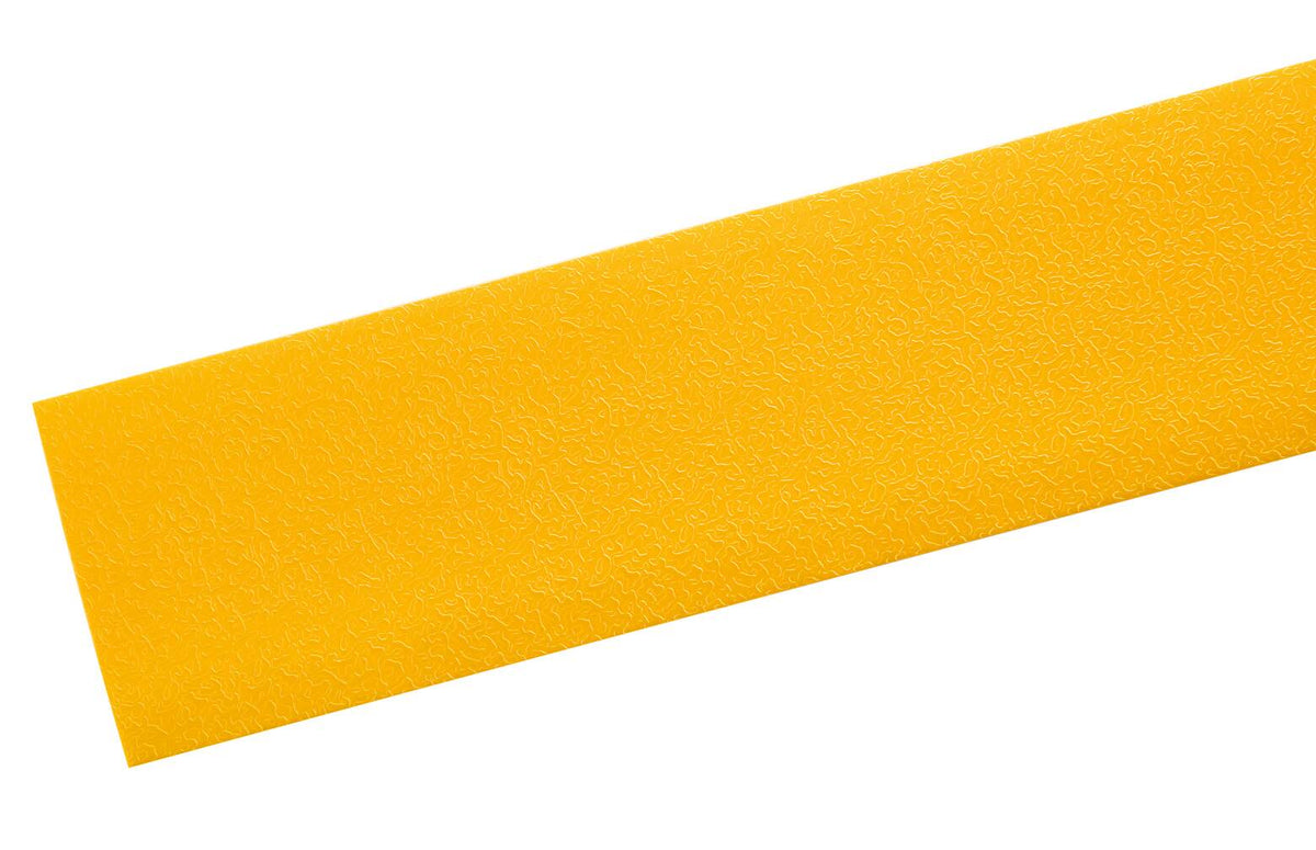 Close view of the textured top surface of yellow DURALINE STRONG floor marking tape