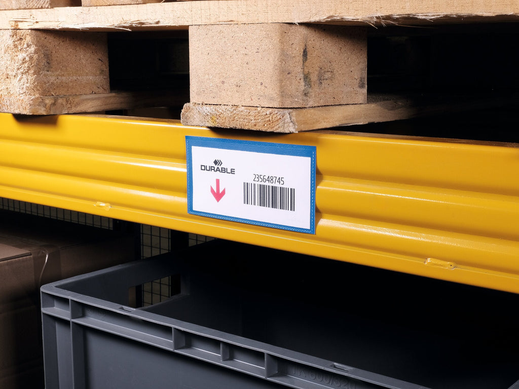 Durable mid-size magnetic label pouch with a barcode label on a yellow racking beam below a pallet