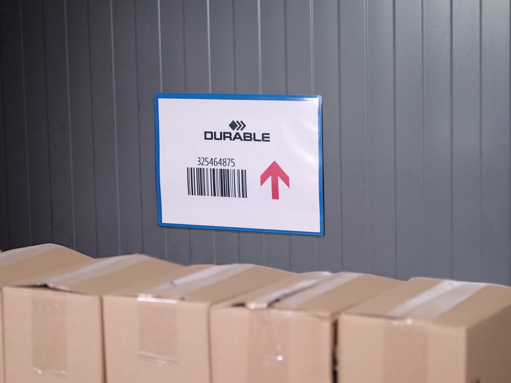 Durable A4 landscape magnetic pouch with a barcode sheet on a grey metal wall above a row of cartons