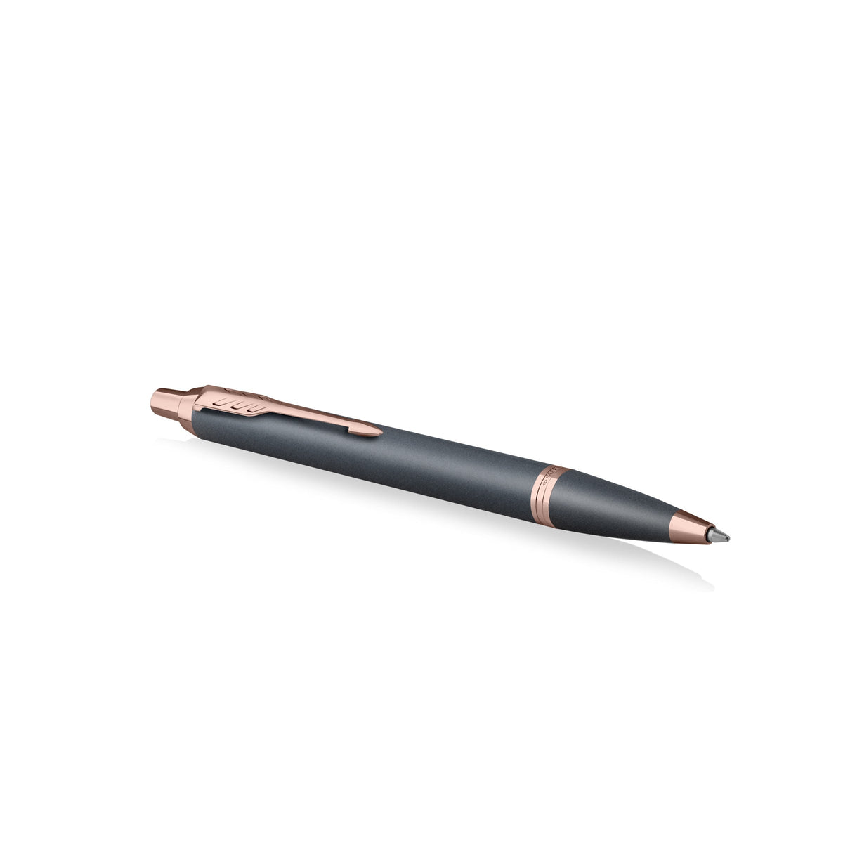 Slate IM Finishing Touch ballpoint lying at an angle with the clip on top and the rose-toned centre ring visible
