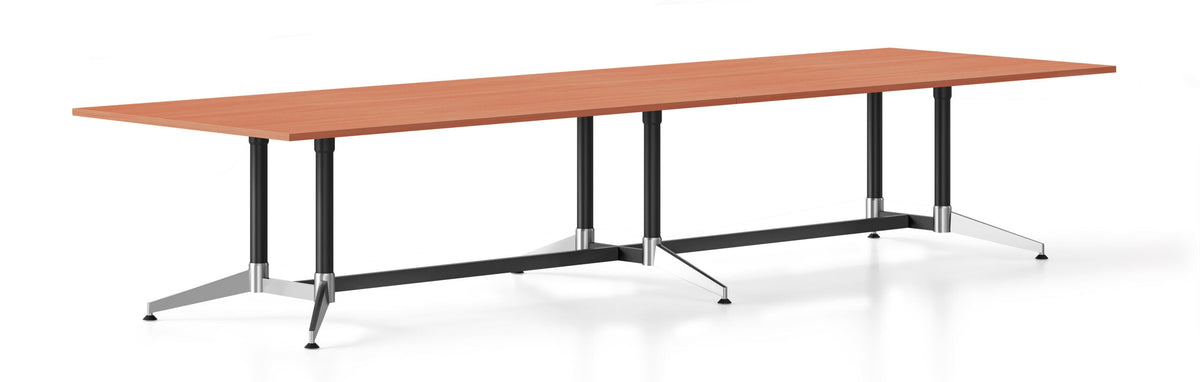 Rapidline Typhoon boardroom table with a Cherry top on a black powdercoat and polished aluminium frame with multiple leg sets, wide studio view